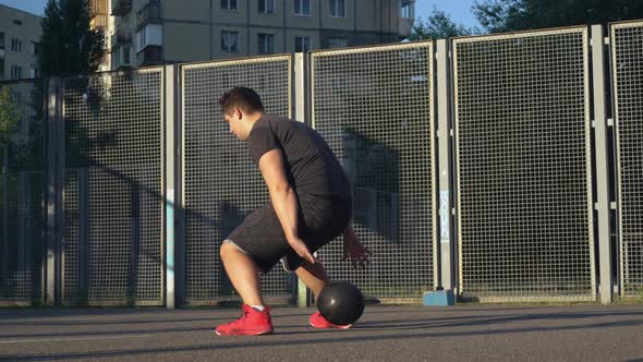 Handsome Basketball Player Training Outdoors