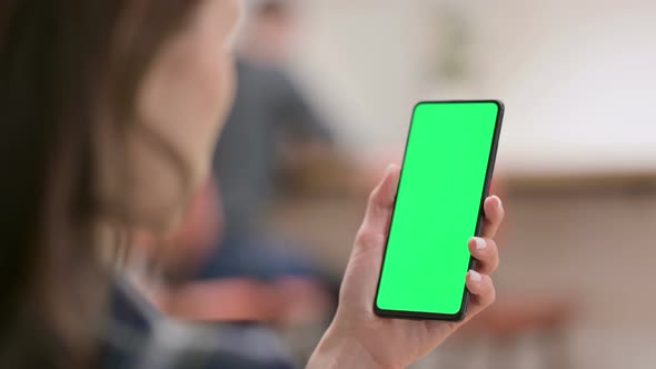 Female Holding Smartphone with Green Chroma Key Screen