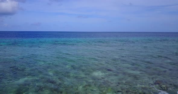 Natural aerial island view of a white paradise beach and blue ocean background in colourful 4K