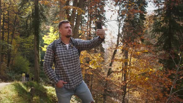 Traveller is Taking Selfie By Smartphone in Touristic Place Visiting Natural Reserve at Autumn