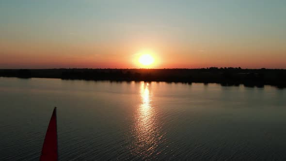 Scarlet sails at sunset, drone