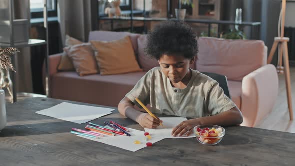 Boy Drawing at Home