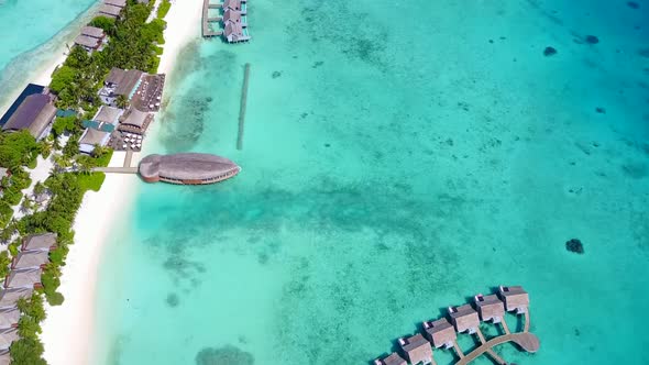 Aerial drone texture of tropical coastline beach by blue sea with sand background