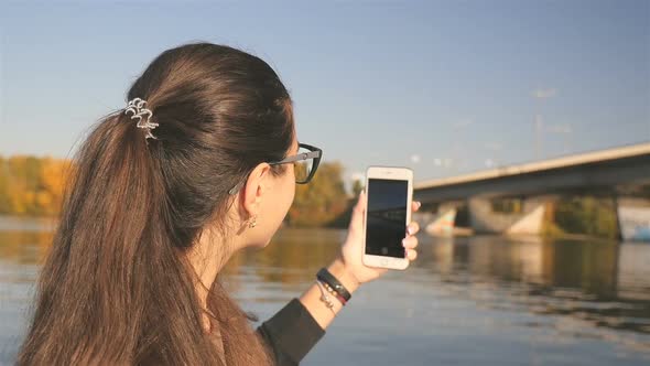 Beautiful Girl Takes Pictures of Nature