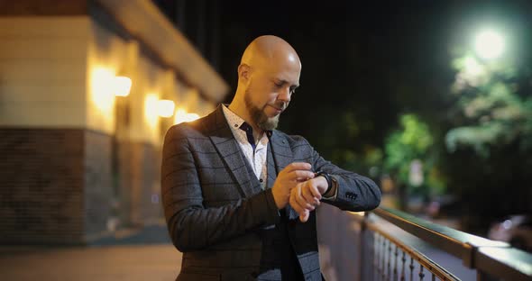 Upset and Angry Man Checking Time on the Watch Waiting for Someone