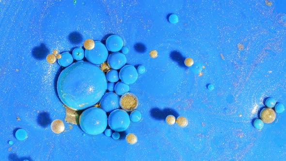 Abstract of Blue Bubbles Bursts and Dissolves in Paint