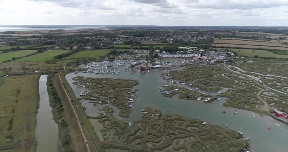 Aerial pull back shot away from Tollesbury Marina