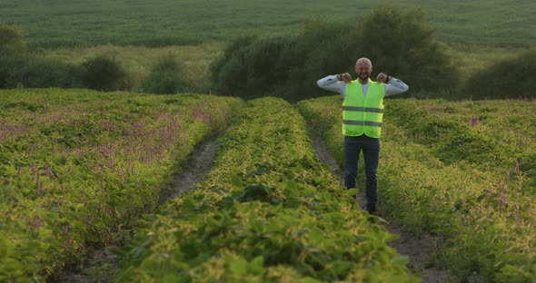 The Young Bearded Agronomist Is Very Happy with the Harvest Quality of the Crop Work for Agriculture