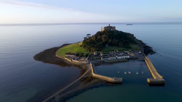 Drone flying around St Michaels Mount in Cornwall. Aerial orbit