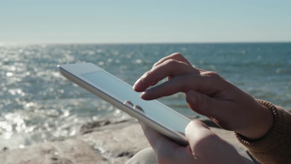 An Attractive Man Student Tourist Guy and a Tablet