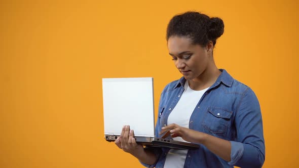 Female Freelancer Working on Laptop, Showing Ok Sign, Satisfied With Connection