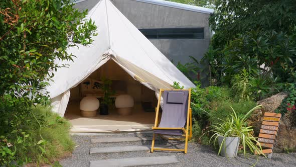 Wide Glamping Tent with Comfortable Modern Interior Open Entrance Lounge Chair