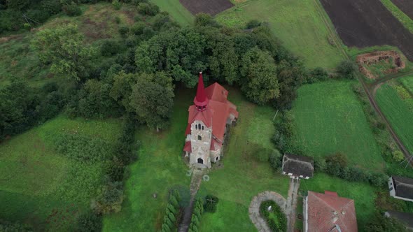 Fly Over the Roman Catholic Church in a Countryside