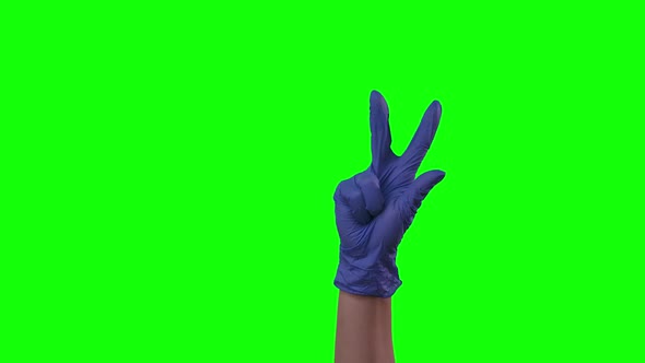 Doctors Female Hand in Blue Glove Is Counting To Five, Green Screen