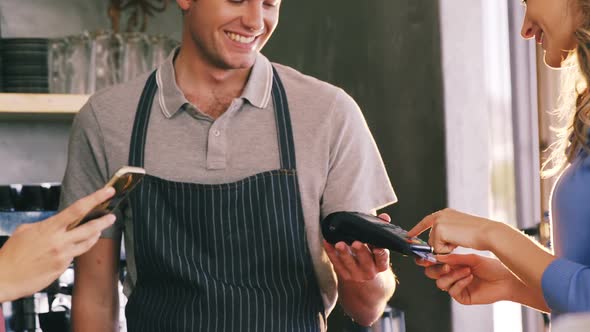 Customer making payment at counter