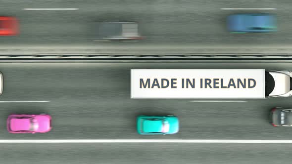 Trucks with MADE IN IRELAND Text Driving Along the Road alt