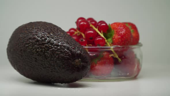 Mixed Fruits In A Turntable Looks Delicious Grapes And Strawberries In A Glass Bowl With Avocado On