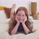 Funny Red-haired Girl with Freckles Smiling on Bed - VideoHive Item for Sale