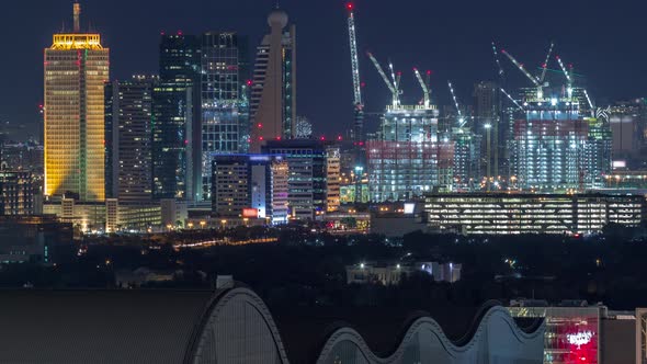 Aerial Nighttime Cityscape with Illuminated Architecture of Dubai Downtown Timelapse United Arab