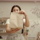 Craftswoman Showing Paper Bag in Pottery Studio - VideoHive Item for Sale