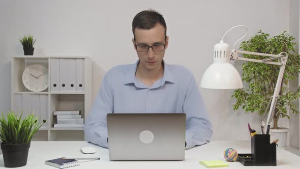 Man Entrepreneur Typing on Laptop Doing Research