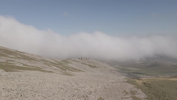 Scenic aerial view of moving white clouds at Abuli Mountain. Georgia