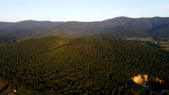 A drone shot of sunlight over the Shenandoah valley and Blue Ridge Mountains, in Shenandoah National