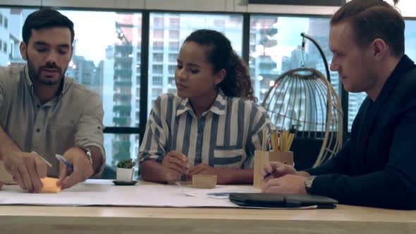 Creative Business People Group Having Conversation at Office Desk in Workplace