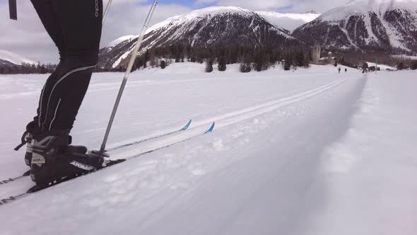 A Woman Practices Nordic Skiing With Classical Technique