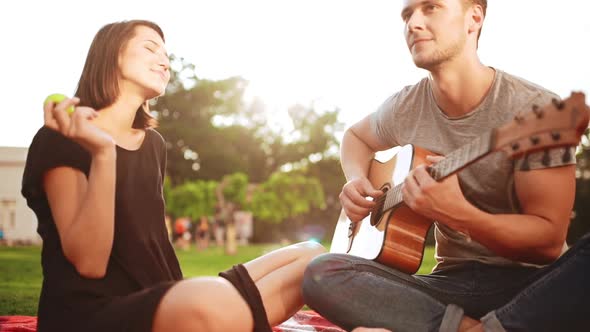 Young Beautiful Couple Smiling Resting in Park