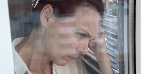 Woman in Solitude By Window