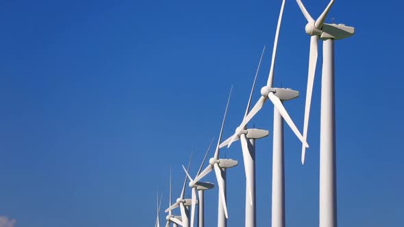 Wind Turbines and Energy Farm at Dusk. Alternative Renewable Energy Production.