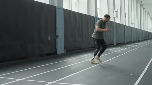 Athlete with Prosthetic Leg Doing Agility Exercise