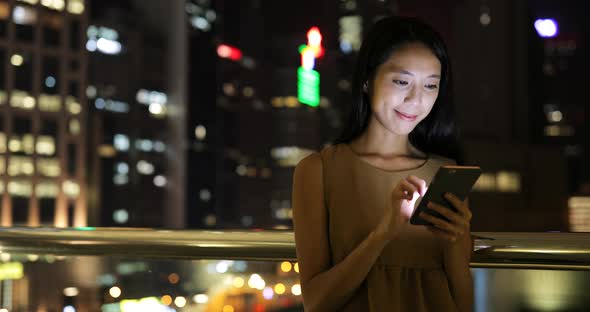 Asian woman use of cellphone in the city