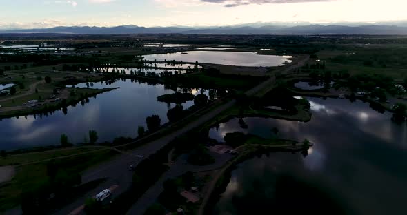 Glorious mountain sunset with reflections in lakes and ponds. Shot by drone from 185ft 4k 60fps