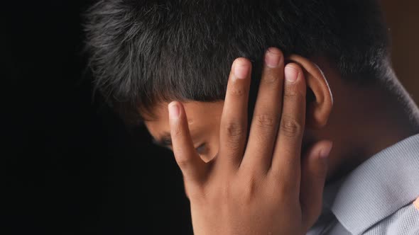 Teenage Boy Having Ear Pain Touching His Painful Ear 