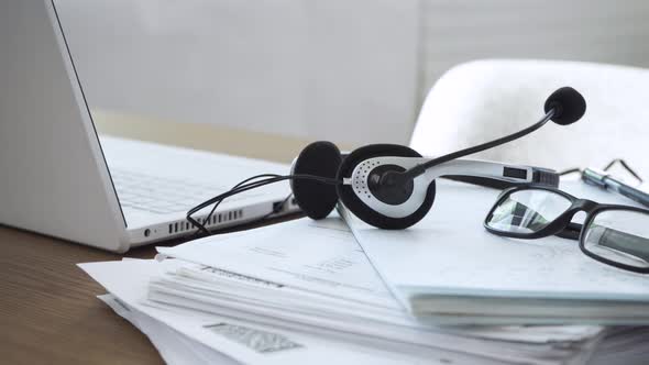 Laptop with Headphones on the Table