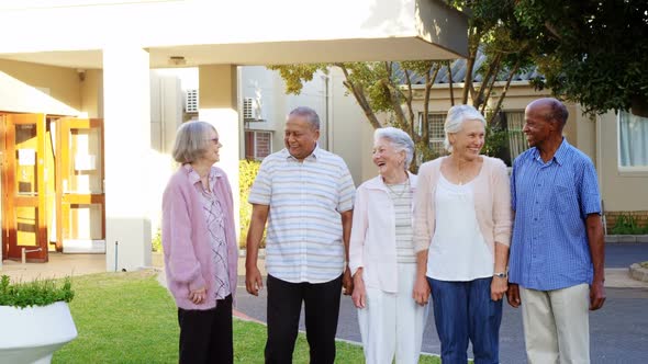 Happy senior friends interacting with each other 4k