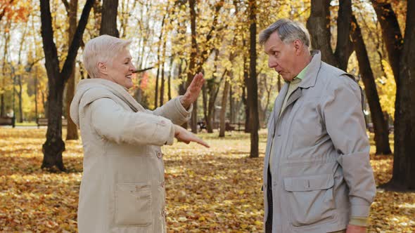 Joyful Elderly Married Couple Doing Exercises Outdoors Positive Old Grandpa and Grandma Smiling