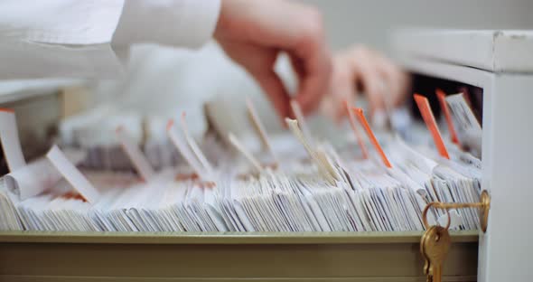 Female Doctor Looks for Personal Data in the File