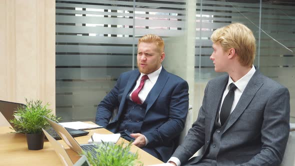 Business People Work Together on Laptop in Office