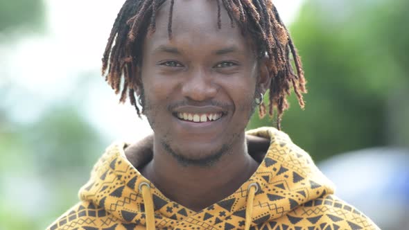 Young Happy Handsome African Man Smiling in the Streets Outdoors