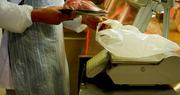 Butcher Weighing Meat in Butchers Shop 4k