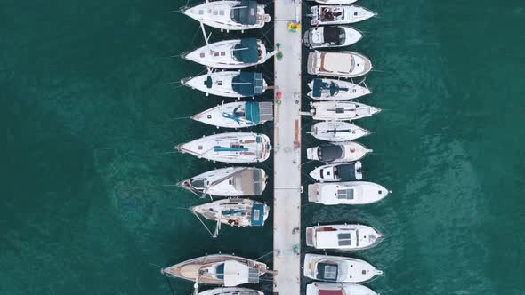 Flying over a marina with boats and yachts.