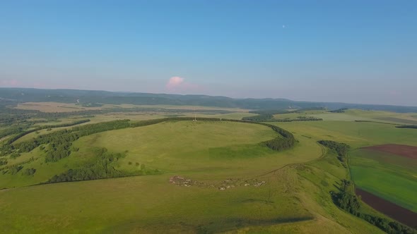 Flying Over Hills of Southern Urals at Sunset