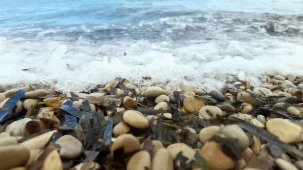 Slow Motion Footage of Waves Breaking on Pebble Beach