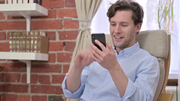 Young Man Doing Video Chat on Smartphone