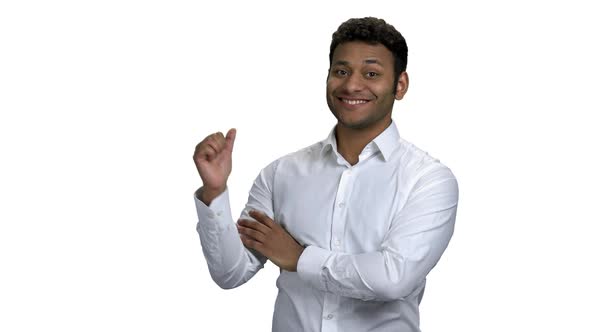 Young Africanamerican Businessman Pointing at Copy Space