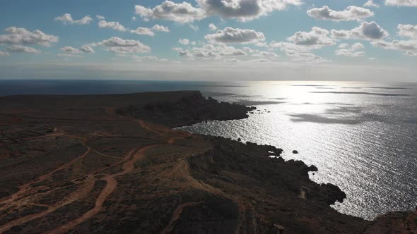 Aerial drone video from northern Malta near the Ghajn Znuber Tower.