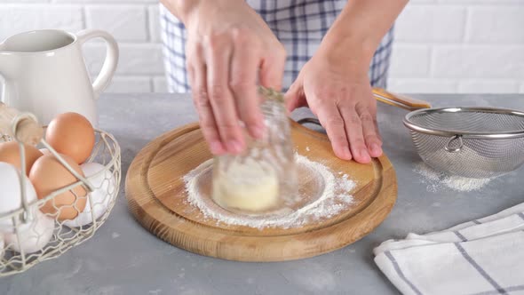 Preparation for cooking cheesecakes with cottage cheese in flour with handwork